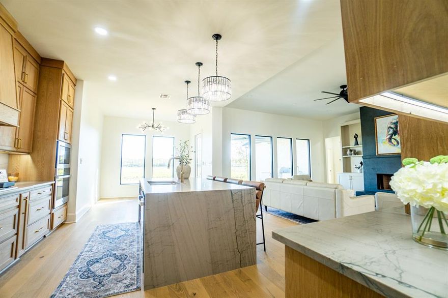 Discover refined luxury in this brand-new home in the gorgeous Duckwater Landing subdivision of Bossier City. Thoughtfully designed by a skilled builder and interior designer, every detail showcases exceptional craftsmanship and timeless style.
Inside, the open-concept layout is anchored by elegant white oak wood floors and custom stained white oak cabinetry that bring warmth and sophistication. The chef’s kitchen features a stunning quartzite waterfall island with matching countertops and a full-height quartzite backsplash—an impressive focal point designed for both beauty and function. Designer lighting and expansive windows fill the home with natural light, creating an inviting atmosphere perfect for entertaining or relaxing. This home features a breakfast room with gorgeous views of the country and a dining room where a luxurious chandelier is the focal point! 
The primary suite offers a spa-like retreat with a spacious layout, elegant finishes, and a soaking tub that invites you to unwind in style and relax under the designer chandelier!
Step outdoors to enjoy the fully equipped outdoor kitchen—ideal for gatherings, al fresco dining, or quiet evenings at home.
This home beautifully blends indoor elegance with outdoor living, setting a new standard for luxury in Bossier City. Schedule your showing today through Broker Bay or feel free to contact the Listing Agent!