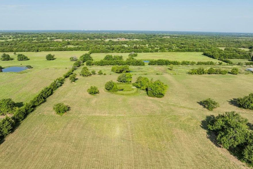 Are you tired of your elbows getting acquainted with your neighbor’s? Dreaming of stretching out on your very own piece of Texas? Well, hold onto your hats because we’re talking about a whopping seven acres in Campbell Texas in Hunt County—plenty of space to claim as your own!

Picture this: a majestic plot of land just waiting for a visionary builder or a daydreamer. No pesky HOA here—because who wants someone telling them how to live their best life? If you’re a business owner with dreams of a metal building, this is your golden ticket. And why stop there? How about a race track for the kids (and maybe a few fun laps for you too)?

Want to build sand dunes for your 4-wheelers or dirt bikes? You’ve got the space... all 286,138 square feet of land. By the way did I mention there's almost 300 feet of frontage. 

So, get out there before someone else puts their name on the mailbox and claims your dream. Seven acres of possibilities are waiting for you in beautiful Texas!