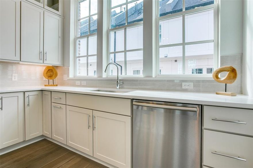 Stunning MOVE-IN READY townhome, minutes from Oak Lawn and Medical District. Sophisticated 2-bed, 2.5 bath design by InTown Homes at Cedar Branch features high-end finishes throughout. The open design, 12-foot ceilings, and abundant natural light on the main level provide a sense of space while the impressive gourmet kitchen features a Bosch stainless steel appliance package, exquisite quartz countertops, tile backsplash, and upgraded stacked upper cabinetry. The primary suite provides an ideal space to unwind, complete with spacious walk-in shower, dual vanity and walk-in closet. Sustainable engineered hardwoods throughout entire home add to the upscale feel, while the rooftop terrace provides an inspiring space for outdoor entertaining or taking in the views. 2-car tandem garage provides plenty of space for parking and additional storage. PLEASE GO TO MODEL HOME FOR OPEN HOUSES - 4645 NEW WATER LN.