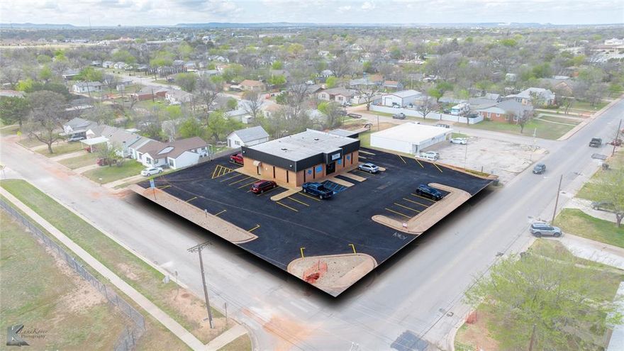 FOR SALE: Commercial Space in SOUTH Abilene, TX. Discover an exceptional opportunity to establish your business in a highly versatile commercial property. Situated on a prominent corner lot, this property blends robust infrastructure with strategic positioning, making it ideal for various business ventures. With its brick exterior and multiple ingress and egress points, this site promises seamless accessibility and visibility for clients and customers alike. Designed with functionality in mind, the interior layout boasts a spacious central hub room, ideal for collaborative workspaces or customer interactions, surrounded by 6-8 smaller rooms that can serve as offices, consultation areas, or private meeting spaces. The property includes two restrooms, ensuring convenience for staff and customers, and a breakroom for employee downtime. It offers four doors for ingress and egress, facilitating smooth and efficient movement within the premises. The property’s exterior is equally versatile, offering 2-3 lane drive-through capability, perfect for businesses requiring quick service or drop-off solutions such as QSRs, delivery, or retail establishments. Benefiting from alley access and an expansive asphalt parking lot, visitors and staff will enjoy hassle-free access. Its location directly adjacent to Bowie Elementary provides added visibility and customer traffic, while being easily accessible to the bustling south shopping district on Buffalo Gap Road enhances its appeal. This commercial property lends itself perfectly to a variety of uses, including office space, retail outlets, delivery and drop-off services, or even a restaurant or quick-service restaurant (QSR). The layout and location combine to offer a dynamic environment adaptable to your business needs, fostering growth and success. Contact CJ to arrange a private viewing or to gather more detailed information. Elevate your business presence with this outstanding commercial opportunity in the heart of Abilene.