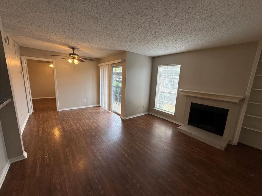 Charming 1-bedroom condo in gated Cimarron Court, priced to sell and ideally located in North Dallas. This 1st floor unit features real hardwood floors throughout, a bright open living area with large windows, and a private balcony for outdoor relaxation. The kitchen offers abundant cabinet space, refrigerator included, and appliances with dishwasher, range, and vent hood. The bathroom provides an extended vanity, ample storage, and a tub-shower combo. A washer and dryer are also included, making this home truly move-in ready. Residents enjoy access to multiple community pools, gated entry, and assigned parking. Conveniently situated near major highways, shopping, dining, and entertainment, this property offers an excellent blend of comfort, convenience, and value—perfect for an owner-occupant or investor seeking a strong North Dallas location.