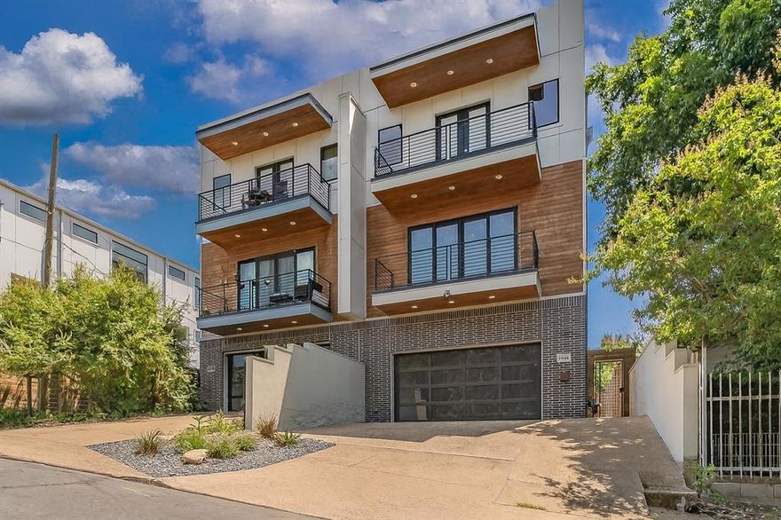 Welcome to this stunning 3-story modern townhome with panoramic rooftop views of Downtown Dallas! This light-filled home features an open-concept living area, gourmet kitchen with quartz countertops and premium appliances, and sleek designer finishes throughout. The spacious primary suite offers a spa-like bath and walk-in closet, while secondary bedrooms provide space for guests, office, or gym. Enjoy multiple outdoor living areas including a private balcony, fenced backyard, and a rooftop deck perfect for entertaining against the city skyline. Additional highlights include a two-car garage, modern fixtures, and a prime location close to Dallas’s best dining, shopping, and entertainment. Schedule your showing today!