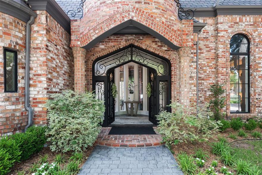 Stately traditional highlighted by timeless elegance in this handsome custom built home in the rarely available Estates section of guard gated Lake Forest. Sited on a nearly .3 acre lot in the highly coveted exclusive enclave with only 19 residences, this home enjoys serenity and privacy. A gracious  double door entry leads to a grand foyer with vaulted ceilings and generously sized formal dining area. Well designed layout with open floorpan framed by walls of windows, high ceilings and exquisite moldings. The expansive great room with fireplace is open to the kitchen and breakfast area with a massive center island, custom built-ins, Wolf appliances including double ovens, microwave, built-in range and warming drawers. The wet bar includes a  commercial ice maker and beverage cooler, and the butler's pantry has custom cabinetry and 2 large closets for storage. The downstairs primary suite boast a sitting area with fireplace and custom built-ins, luxurious separate his-her baths and two custom finished walk-in closets. An additional guest suite is located on the first floor for convenience. Upstairs provides stunning views of the private lake and encompasses three additional bedrooms and a game room with wet bar. The generous sized media room features a large wall mounted screen, projector and surround sound. Beautiful features and amenities for everyday living and entertaining including white oak flooring, whole house automated lighting, whole house sound system, a marble floored temperature controlled wine cellar, elevator, and three fireplaces. The attached 3 car garage features custom cabinetry and a dog washing station. This elegant retreat offers security, luxury, privacy, and amenities galore! Lake Forest is comprised of 170 acres of park-like grounds with green spaces, lakes, and towering oaks. Residents enjoy walking trails, community pool, tennis & pickle ball courts, and dog parks.