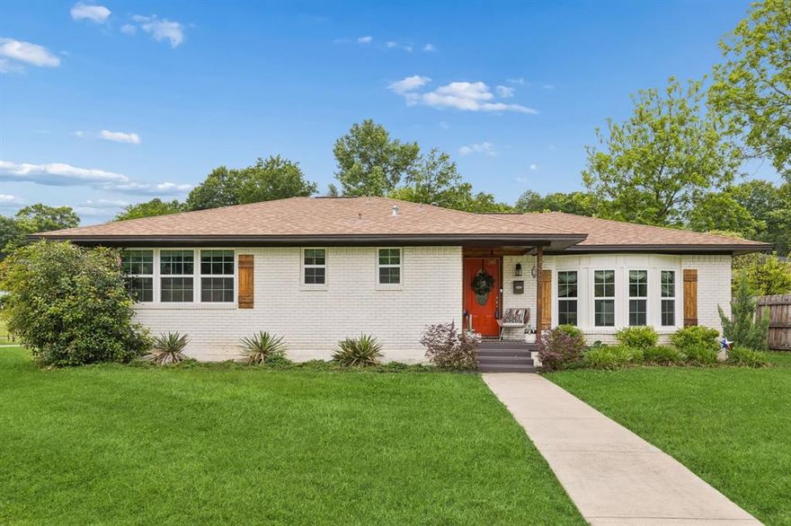 Discover a beautifully updated Mid-Century Ranch in sought-after Druid Hills, Oak Cliff. Built in 1959 and offering 1,582 square feet, this 3-bedroom, 2.5-bath home blends classic architecture with thoughtful modern upgrades on a large corner lot across from the Keist Park Conservation Area, ensuring unobstructed green views and lasting privacy with no homes directly across the street. Inside, abundant natural light pours through expansive windows, highlighting a semi-open layout that provides both flow and distinct living spaces. The remodeled kitchen features granite countertops, a mosaic backsplash, and ample cabinetry designed for everyday functionality and entertaining. The primary suite showcases a custom closet system and an upgraded ensuite with natural stone marble flooring, an onyx sink, and full tile surrounds for a refined, spa-like feel. A convenient Jack-and-Jill bath connects secondary bedrooms, enhancing usability and design continuity. Recent improvements include a 2021 upgraded HVAC system, professional exterior sealing, and added perimeter insulation beneath the home to boost energy efficiency and comfort year-round. Outside, mature landscaping elevates curb appeal, while the oversized yard offers flexible outdoor living potential for relaxing, gardening, or entertaining. Wide, tree-lined streets and close proximity to Kiest Park and the Oak Cliff Nature Preserve provide exceptional access to green space, scenic walking trails, and outdoor recreation. This move-in ready residence combines location, upgrades, and timeless style—ideal for buyers seeking a well-maintained home in a peaceful setting with convenient access to Bishop Arts District and major Dallas thoroughfares, while enjoying a quiet neighborhood atmosphere with enduring appeal. Professional photos coming soon.