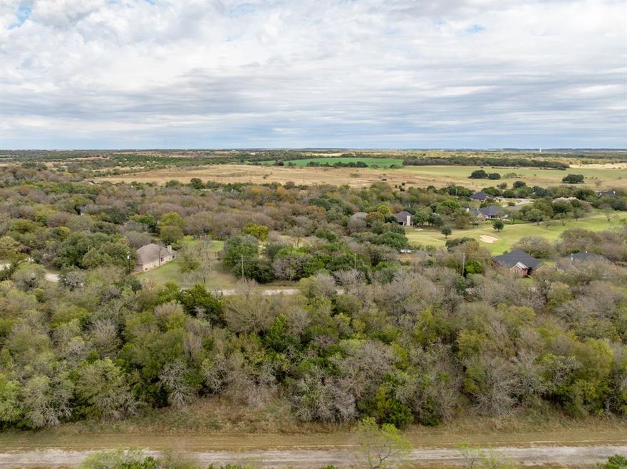 Building lot located near the New Course! Enjoy a relaxed lake life of fishing, picnicking, and kayaking just steps away from your property. Only an hour’s drive from both Dallas and Waco, making it a perfect location to build the home of your dreams or weekend getaway spot . Two award winning 18-hole golf courses with 36 rounds of golf included per year. Restaurants, tennis and basketball courts, 4 pools, boat ramp, marina, fitness center, Spa, Hotel, cabins, 24 hour security and the breathtaking beauty of Lake Whitney!