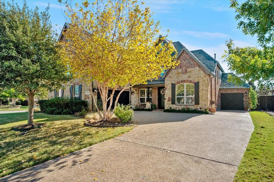 Stunning Trophy Club home offers approximately 3,628 square feet of living space with 4 bedrooms and the 3.5 bathrooms. The brick exterior and mature landscaping create an inviting curb appeal, complemented by the 3 car garage and swing driveway. The interior boasts a spacious and open layout, filled with abundant natural light that accentuates the elegant architectural details and finishes throughout. The living area features a rustic stone fireplace, providing a cozy ambiance. The first floor also has an office, hidden storm shelter, and an oversized laundry room. The open staircase design adds visual interest, leading to the second level, which includes sizable bedrooms, a built-in desk, game room and a media room. The dining space is elegantly appointed, offering abundant room for family gatherings. The kitchen features custom lighting, double ovens, and an oversized island perfect for meal preparation and entertaining. Stepping outside, the lush landscaping and stone patio create an inviting, private outdoor oasis, complete with an outdoor kitchen and fire pit with ample room for dining and entertaining. The backyard also has plenty of green space for the dogs to play. Overall, this home offers a harmonious blend of elegant finishes, ample living space, and thoughtfully designed indoor and outdoor areas, steps from the dog park, playground and minutes from DFW Airport, dining and shopping, making it ideal for any family.