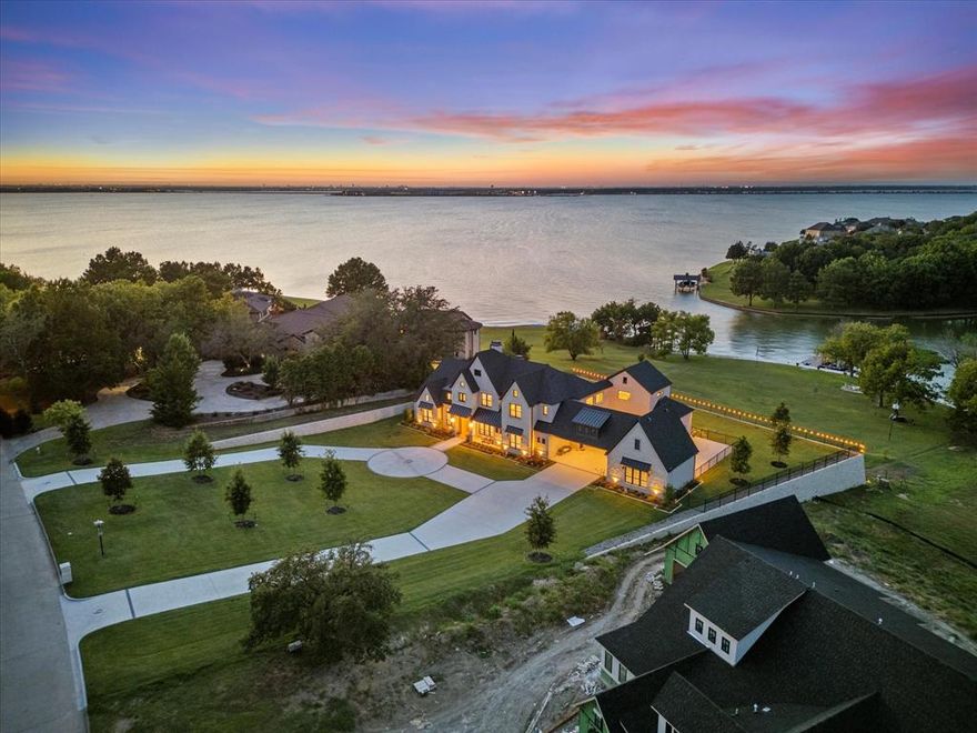 True custom LAKEFRONT LUXURY completed in 2024, this nearly 6,000 SF estate combines impeccable design (& quality) with comfort and relaxation. Set on over an acre—nearly two acres including the lakefront take-line—this resort-style retreat offers five bedrooms (with potential for six), including four ensuites on the main level, a private office, and a secondary living area. Upstairs, you’ll find a fifth bedroom & bath, an additional living space, and a lake-view office or study that captures breathtaking vistas. Outdoor living is equally spectacular—a resort-inspired pool and lounge area invite you to unwind the moment you arrive. Covered parking for six includes two oversized two-car garages and a double porte cochère. The take-line area leased from the City of Dallas provides nearly an extra acre of useable space and leads to the custom boat dock with two PWC lifts. A new bulkhead and sidewalk complete this move-in-ready lakeside masterpiece. Pics are awesome but a in-person experience is a must. You truly cant feel the actual comfortable luxury this property boasts!