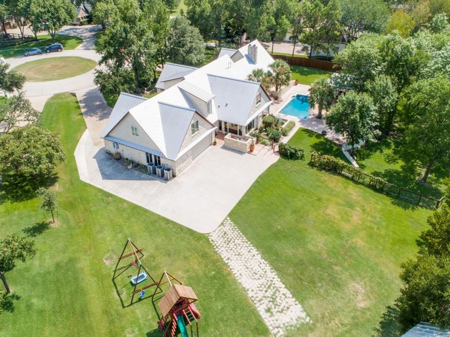 Prime location in Coppell on the exclusive street of Cottonwood Drive. This Custom home offers everything to include a pond, a full barn and several outdoors living areas all on over 8 acres.  The interior features 6 bedrooms, 6.5 baths, 5 living areas, 2 dining areas, 2 study areas, game-media room, exercise room, and craft-mud room. Outdoors retreat entails open patios and a covered living area with fireplace to overlook the charming barn that has 4 stalls with a tack room and a creek filled pond.  Property also offers riding arena and fenced pasture. Updates to include new outdoor cabana, new tile work in kitchen fresh paint, new carpet, new shutters, new HVACS, new hot water heater. Meticulously maintained property with endless views. 469 sq ft of bonus living for various uses.  A true gem that must been seen to appreciate everything this estate has to offer.