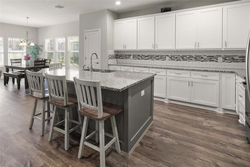 Built just 5 years ago! Beautiful 4-bedroom, 2-bath home with picture-perfect curb appeal offering a modern neutral palette and abundant natural light for a bright, inviting feel. The charming front porch is ideal for relaxing with morning coffee. While it appears cozy from the outside, this home is spacious and open inside. The kitchen offers generous counter space, beautiful granite finishes, island seating, and endless storage. It flows seamlessly into the living and dining areas allowing for family-time and holiday celebrations. Natural stone accents continue into the bathrooms for a touch of luxury. The fourth bedroom adds flexibility as a home office, craft room, or flex space. Enjoy a mudroom with backpack-drop zone keeping the rest of the home clutter-free. The expansive backyard is ideal for everyday play, entertaining, and cookouts. Gutters and drip irrigation make upkeep easy. Bonus: With a strong offer, refrigerator, washer, and dryer convey. Make an appointment today to see this move-in-ready home in an established neighborhood with modern updates and a functional layout!