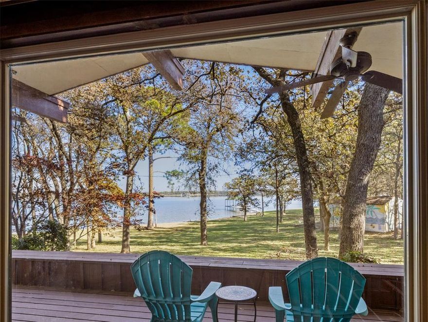 Old School Cool! A 1,550 Square foot weekender Cabana on 5.485 heavily treed acres with huge waterfront and newer dock, Azle side of the lake, north of Peden Road. The value here is almost exclusively in the land, but the cabana is your lagniappe, with a retro cool vibe, and a remodel by noted Fort Worth Architect Al Komatsu and Associates (plans available).

Enjoy the weekender while you create plans for your next waterfront palace or primary home! Then it becomes a guest cabin for friends and family! The sea wall is in fabulous shape and features a boat ramp beside the newer covered dock with one boat slip, ski doo rack, and Trex deck walkway and decking. A three-bay garage provides storage options for boats and vehicles further up the driveway, while a whimsical boat house on the sprawling green lawn provides storage for water toys, furniture, jet skis, etc.

Two lots total almost 5.5 acres and are heavily treed with mostly Post Oaks. Gradual sloping lush lawn and beach lead into the lake, easy access to the water for swimming or just floating around!!

Please note this is a survey of only one of the two lots, Buyer will need new survey. The property will be conveyed in As is, Where is condition.