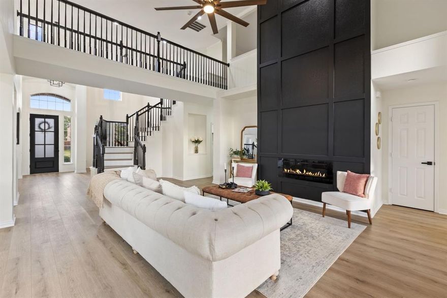 *SELLER'S PREFERRED LENDER OFFERING A 2% CREDIT TO BUYERS WHEN UTILIZED FOR FINANCING* COMPLETELY REIMAGINED WITH BEAUTY AND MODERN STYLE IN MIND!! Located in Rowlett’s highly sought-after Waterview community, this 4bed, 3bath showpiece will leave you speechless! Step inside to soaring ceilings, so much natural light, an open concept layout, a grand staircase, and a stunning floor-to-ceiling statement fireplace that anchors the living room with modern elegance.

The chef’s kitchen features crisp white cabinetry, a rounded-edge island, quartz countertops, designer lighting, and stainless appliances — all perfectly curated for entertaining & everyday living.

The primary suite is an absolute retreat with a bold floral accent wall & a spa-inspired ensuite showcasing a freestanding tub, massive walk-in shower, double vanity sinks & floor-to-ceiling designer tile.

This home has 2 flex spaces (1 upstairs, 1 downstairs) which can easily be utilized as second living areas, office, child's playroom, media room, etc. There is also a sizable formal dining room, and a breakfast nook, along with a beautiful laundry room. 2 bedrooms are located upstairs, and 1 downstairs + the primary retreat.

TO TOP IT ALL OFF - Enjoy resort-style amenities including an 18-hole golf course, multiple parks, pools, trails, tennis, and a fishing lake - all within the prestigious Waterview community. THIS HOME IS A ONE OF A KIND!! MUST SEE BEFORE SHE'S GONE!