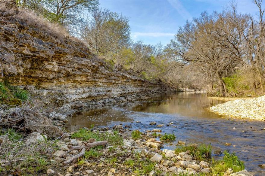 This exceptional ±135-acre ranch on the Nolan River in Blum, TX offers a beautiful mix of rolling terrain, usable open pasture, and heavily wooded areas filled with native hardwoods. Running through the middle of the ranch is the scenic Nolan River, creating a peaceful setting with excellent wildlife habitat and recreational appeal. A network of established trails makes navigating the property easy by foot, horseback, or ATV.  Currently utilized for hunting and outdoor recreation, this versatile ranch presents outstanding potential for a private retreat, working ranch, homesite, hunting property, or future investment. Property may be subdivided, and an additional ±10 acres is available for purchase to expand river frontage and enjoyment.