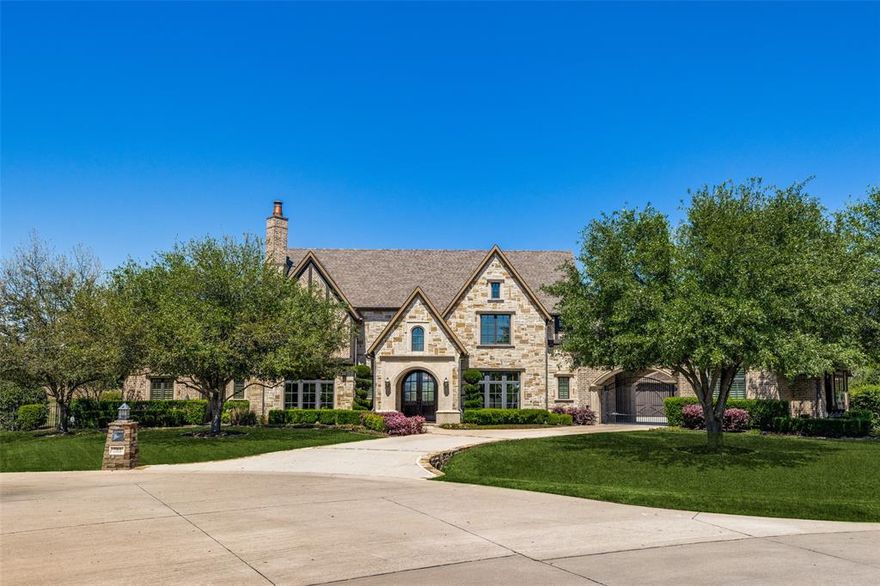 Stunning home in sought after Tranquility Farms exemplifies luxury living on an acre lot! Captivating porte-cochere sets the stage for a grand entrance with perfect floorplan and exceptional private pool and outdoor living with fireplace and outdoor kitchen.  Hardwood floors in the main living areas downstairs complemented by a bar adjoining the beautiful formal dining room plus living room has a cozy fireplace. The heart of the home lies in the gourmet kitchen boasting a sprawling island, Viking gas range, sub-zero refrigerator with adjacent breakfast room overlooking expansive covered patio. Handsome study with french doors overlooks huge yard! Ensuite guest room downstairs and 3 generously sized ensuite brs up with WICs. Go up back staircase to the media and game room with wet bar-so private! Walk-out attic, tankless water heaters, fire suppression system, 4 car split garages, mud room, locker room. Must view to see all the extras!