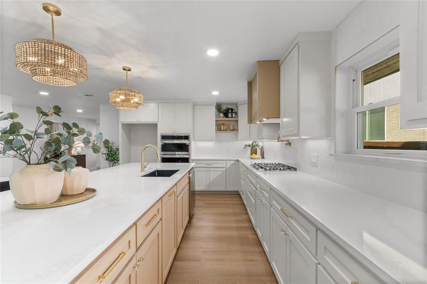 Welcome to 9016 Westbriar Drive, a thoughtfully updated modern farmhouse offering a 4 bedroom, 3 bath layout with an office, two living areas, and a split 1.5 story floorplan. Every space has been reimagined with a focus on style, comfort, and long-term value, brought to life through the craftsmanship of The Twenty One Group. Set in an established neighborhood rich in community—and just minutes from White Rock Lake, the Dallas Arboretum, scenic trails, parks, and vibrant local dining—this home blends elevated design with an exceptional East Dallas lifestyle. Inside, natural light and clean lines create a warm, inviting atmosphere. New LVP flooring and designer tile set a cohesive foundation, while custom finishes, built ins, and fresh paint elevate each room. The massive kitchen balances beauty and function with soft close cabinetry, quartz countertops, a tile backsplash, under cabinet lighting, and SS appliances. Two living areas offer flexibility for gathering or relaxing, and the dedicated office provides a quiet, private workspace. The bedrooms are thoughtfully separated, and the bathrooms feel spa inspired with frameless glass, custom niches, and designer tile. The exterior has been refreshed with updated landscaping and privacy fence. Cedar accents on the front porch add charm, while the swing gate and updated sprinkler system enhance everyday convenience. Behind the scenes, the home has been upgraded with longevity in mind. Improvements include updated HVAC ductwork, a tankless water heater, energy efficient windows, and enhanced attic insulation. The oversized two car garage—newly built out from a former carport—is finished with drywall and features a new motor and door. Blending curated design, meaningful mechanical upgrades, and the best of East Dallas living, this move in ready home is crafted for comfort, connection, and long-term value.