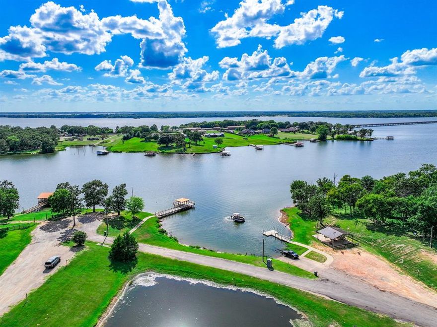 Turnkey furnished Lake Fork retreat in the gated community of Holiday Villages. This updated 3-bedroom, 2-bath home offers flexible living for full-time residents, weekend lake lovers, or investors seeking a move-in ready opportunity near one of Texas’ most legendary bass fishing lakes.
Offered fully furnished, the home provides immediate usability and added value for today’s buyer. The open-concept layout features a spacious living area and an eat-in kitchen with stainless steel appliances, creating an inviting space to relax or entertain after a day on the water. The primary suite is conveniently located on the main level, while two additional upstairs bedrooms offer space for guests, family, or a home office. Recent updates—including a newer roof, updated HVAC system, and modern interior finishes.
Step outside to a private backyard overlooking the community pond, offering a peaceful setting to enjoy quiet mornings, evening sunsets, or simply unwind. Residents of Holiday Villages enjoy access to community amenities including a covered fishing dock, private boat ramp, saltwater swimming pool, clubhouse, and playgrounds—making it easy to enjoy fishing, boating, and the relaxed Lake Fork lifestyle.
Whether you're searching for a primary residence, a weekend fishing getaway, or a furnished investment opportunity, this property presents an excellent value in one of Lake Fork’s most popular gated communities.