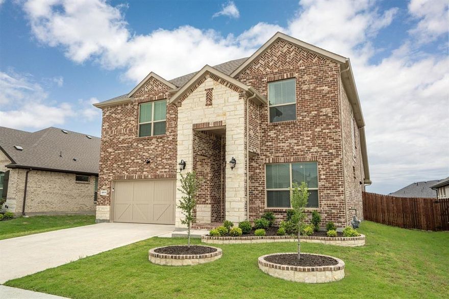 Welcome home to this Stunning two-story gem in Argyle, TX! Step inside this beautifully maintained home and discover comfort, style, and functionality at every turn. The heart of the home is the immaculate kitchen, featuring sleek stainless-steel appliances, a spacious kitchen island, decorative lighting, and ample built-in cabinetry with added lighting, perfect for everyday living and entertaining. The inviting living room offers a warm and cozy ambiance, enhanced by large windows that flood the space with natural light. When it's time to wind down, close the window coverings and enjoy the perfect setting for a movie night. Retreat to the serene primary bedroom, where a rich, calming wall color sets a dreamy tone for relaxation. The luxurious ensuite bathroom boasts dual sinks, a garden tub, and a separate walk-in shower for your ultimate comfort. With a total of five bedrooms and four bathrooms, there’s plenty of space for loved ones and guests. Upstairs, a massive bonus room provides endless possibilities, ideal as a playroom, media room, or dedicated study space. Outside, enjoy the expansive green lawn and a covered patio perfect for outdoor gatherings or quiet evenings. Don’t miss your chance to own this pristine Argyle home—schedule your tour today!