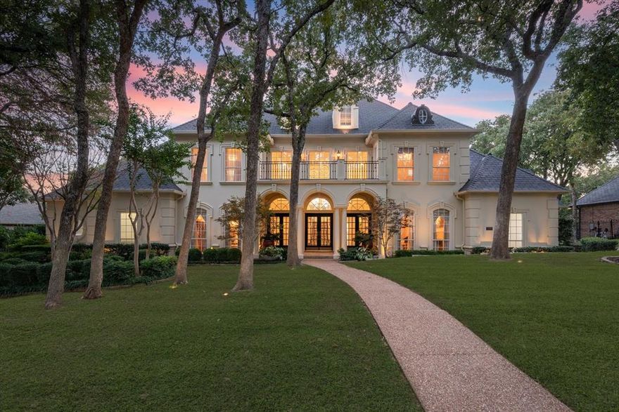 Welcome to 1218 WYNDHAM HILL LANE - a stunning transitional home in Southlake’s exclusive gated neighborhood of Wyndham Hill. This grand 5-bed, 5.5-bath home is beautiful inside & out. The property is surrounded by walking trails, lakes & parks — perfect for a morning stroll. The bright & airy great room overlooks a luscious green-belt and features floor-to-ceiling Pella energy-efficient windows. Enjoy a modern chef’s kitchen, designed for style and function. Boasting state-of-the-art Sub Zero, Wolf & Miele appliances, including a 200+ bottle wine and beverage center — ideal for the entertainer. A galley sink makes food prep & clean up a breeze. The spacious primary bedroom includes a formal seating area & motorized black-out shades. Its ensuite bathroom has in-floor heating & a hidden television. The other four spacious bedrooms and ensuite bathrooms have wood floors & marble bathroom features. Other standouts are the wood-paneled library, nature-filled backyard, and a craft room.