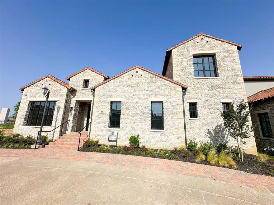 A statement of timeless elegance in the heart of Westlake, 48 Cardona Drive embodies luxury living at its finest. Spanning 4,929 square feet, this exceptional four-bedroom residence showcases impeccable craftsmanship, expansive interiors, and a design curated for both grand entertaining and intimate everyday living.From the moment you step inside, light-filled spaces and refined finishes create an atmosphere of effortless sophistication. Just off the grand entry, a beautifully appointed home office features vaulted, beamed ceilings and an elegant Visual Comfort chandelier—perfect for working in style.
The great room offers an impressive sense of scale, ideal for oversized furnishings and gatherings alike. A striking feature wall with a linear fireplace, designer ceiling treatments, and sliding glass doors seamlessly connect the interior to the outdoor living spaces.
The kitchen is a true showpiece, appointed with custom cabinetry, Taj Mahal quartzite countertops, Sub-Zero and Wolf appliances, and a fully outfitted back pantry with built-ins—designed for both beauty and functionality.The primary suite provides a serene retreat, complete with a spa-inspired bath featuring a soaking tub, dual vanities, an oversized walk-in shower, and a spacious custom closet. The main level also includes a private guest suite and a thoughtfully designed laundry room.
Upstairs, a comfortable lounge area is complemented by two generously sized bedrooms, each with en suite baths. The lower level features an oversized three-car garage with additional space for storage or a golf cart. Designed for seamless indoor-outdoor living, the main level opens to a stunning outdoor sanctuary complete with a pool, expansive dining patio, and built-in gas grill—perfect for entertaining or relaxing in style.Located within the coveted Entrada community, this home offers an unparalleled lifestyle defined by elegance, comfort, and distinction. Students may attend Westlake Academy or Southlake Caroll ISD