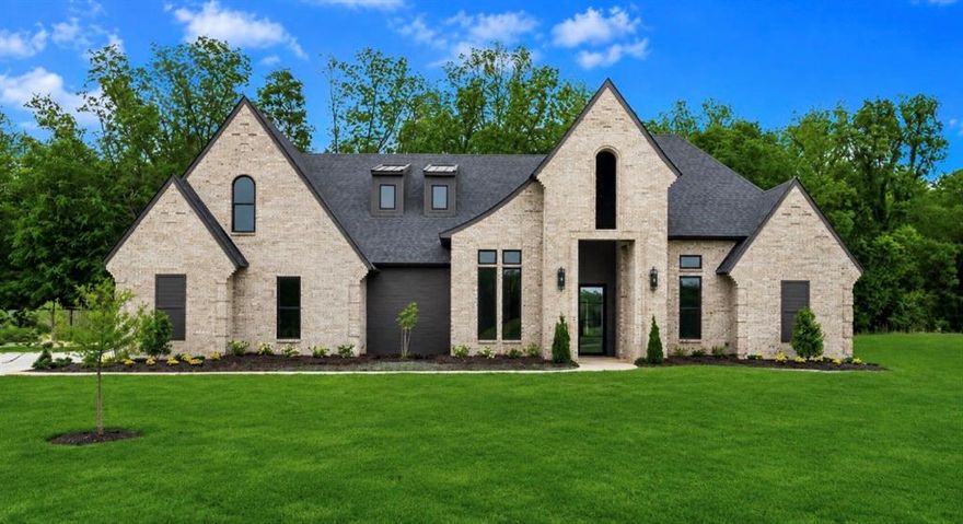 This exceptional new construction redefines what it means to rise above the ordinary builder grade design. With 3,333 square feet, 6 bedrooms, and 3.5 bathrooms, every detail has been carefully planned and executed, from the architectural flow to the hand selected finishes.

At the heart of the home, the expansive kitchen features oversized glass chandeliers, illuminating the striking quartzite slab. The kitchen is further enhanced by both a butler’s pantry and an additional walk-in pantry, offering abundant storage and functionality.

Blending traditional charm with refined elegance, this thoughtfully designed home delivers both style and substance in a truly unforgettable way. These highlights are just a glimpse of what this remarkable home has to offer. Schedule your private showing to explore the many additional features and thoughtful details in person.