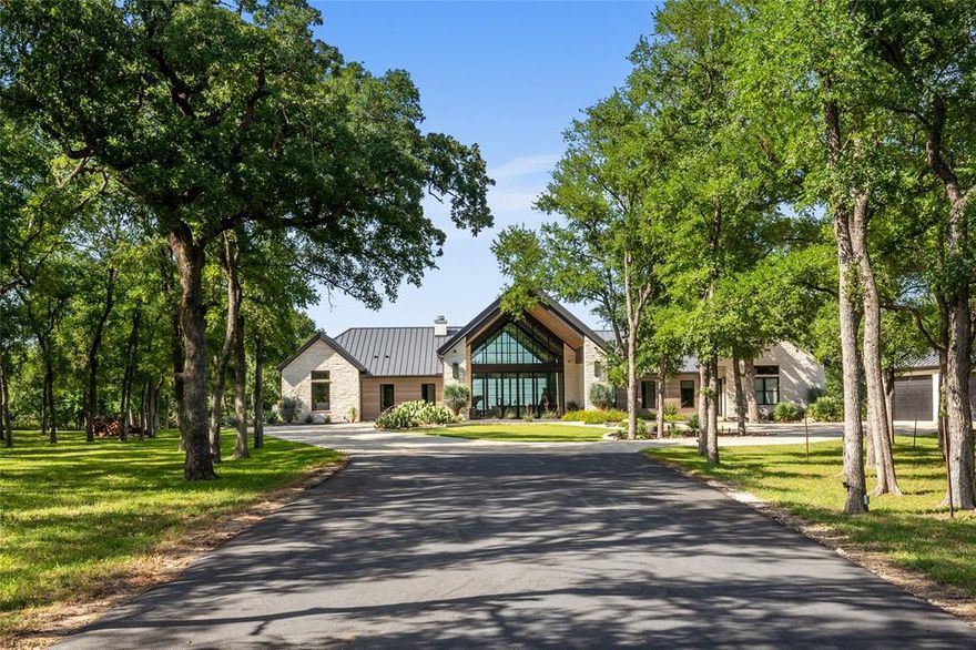 Exceptional 387± Acre Ranch with Luxury Home, Lakes, and Scenic Views

Discover the beauty and tranquility of this stunning 387.148-acre ranch featuring rolling topography, majestic live oaks, mature pecan trees, and three large, picturesque lakes. With over 7,000 feet of paved road frontage, this premier property offers both privacy and accessibility.

At the heart of the ranch sits a luxurious custom-built home (constructed in 2019), offering 4,302 square feet of refined living space. The residence features 4 spacious bedrooms, 3.5 baths, and upscale finishes throughout—including high-end quartzite countertops, premium appliances, and a breathtaking negative edge pool that takes full advantage of the panoramic views.

Complementing the main residence is a 4,000 SF barn with an additional 950 SF of comfortable living quarters, including 1 bedroom and 1 full bath—perfect for guests or ranch staff.

This is truly a one-of-a-kind property, ideally located just 30 minutes from Taylor and the Samsung facility, as well as Temple-Scott & White to the north. Whether you're looking for a family retreat, an income-producing ranch, or an investment opportunity with long-term upside, this ranch has it all.

A must-see property that seamlessly blends luxury living with natural Texas beauty..