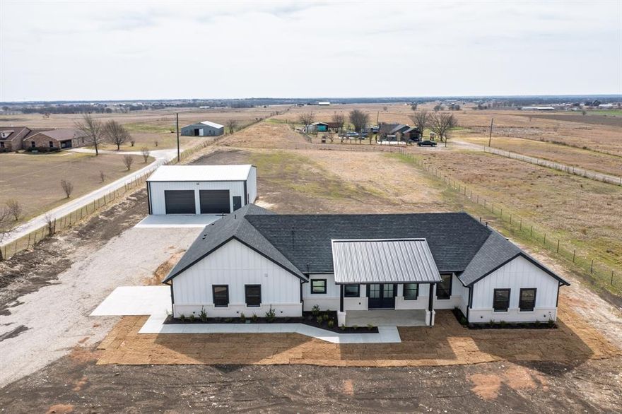 Set on a beautiful two acre tract, this newly constructed modern farmhouse offers the perfect blend of farm life and city accessibility. Wake up to open skies, fresh country air, and breathtaking views of the surrounding countryside. all while being just minutes from the amenities, shopping, dining, and schools of Waxahachie.

Designed for modern living, this bright open-concept home seamlessly connects the living, dining, and kitchen areas  perfect for entertaining or relaxed family evenings. Large windows fill the space with natural light and frame the scenic views, creating a warm, inviting atmosphere.

What truly sets this property apart is the impressive 1,600 square foot shop a rare and highly desirable feature on a two acre tract. Whether you need space for a home based business, hobbies, equipment, vehicles, or recreational toys, this shop offers incredible flexibility. Even better, it includes its own private half bathroom, adding convenience and functionality for long workdays, projects, or hosting gatherings without ever needing to step inside the main home.

Approximate access to major routes:
10 to 15 min to Interstate 35E (north-south corridor to Dallas Fort Worth).
15 to 20 min to U.S. Hwy 287 (east-west access through Waxahachie and beyond)