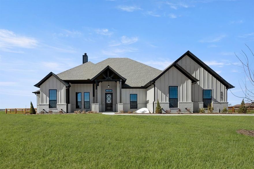 MLS#  21160971 - Built by Brookson Builders - Ready Now! ~ Reach out for details on our Brookson Bucks! Tucked inside the scenic Green Prairie Estates community, this expertly crafted 2,979 sq. ft. home combines high end design with everyday comfort. From its striking painted brick exterior and black window accents to the vaulted ceilings and custom finishes throughout, every detail is thoughtfully curated. Inside, the open concept floor plan features 4 bedrooms, 3 full bathrooms, a private study, and a versatile game room perfect for entertaining or relaxing. The heart of the home is the chef’s kitchen, boasting double ovens, custom backsplash, ceiling height cabinetry, and a trash can pullout in the oversized island. The adjoining living area showcases a floor to ceiling painted brick fireplace, complemented by built in base cabinetry and floating shelves on either side. Retreat to the, where a barn door opens to a spa inspired bath, complete with a mirror on the interior bathroom side, freestanding tub with custom tile surround, and a frameless glass shower with a half wall design. Additional touches include square sinks in all bathrooms, a custom lighting package, wood look tile flooring, and upgraded carpet padding. Step outside to the covered back patio, featuring a two toned sliding glass door, outdoor fireplace, TV hookups, and an extra ceiling fan perfect for year round outdoor living. Designed for both style and function, this home offers the space, features, and comfort to match your lifestyle. Schedule a visit to 4867 Prairie Sky Lane and see for yourself what sets this home apart.