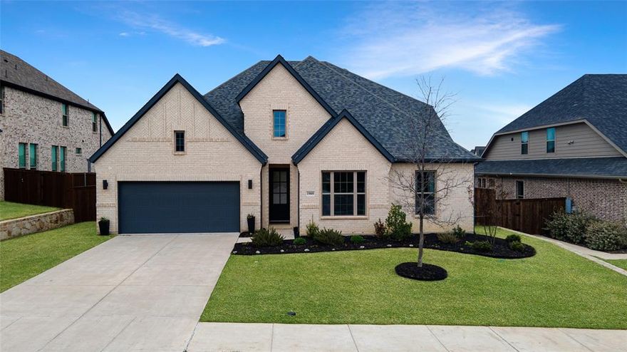 Welcome to 1909 Century Lane, a beautifully designed home that blends comfort, style, and functionality. A stunning sliding wall of windows fills the living area with natural light and opens to the covered patio, creating seamless indoor-outdoor living. The patio features built-in speakers that extend into the living room—perfect for entertaining while enjoying the huge backyard.

The kitchen is thoughtfully designed with a 5-burner gas stove, double ovens, and an oversized upgraded walk-in pantry large enough to store small kitchen appliances. The upgraded mud area features stylish hardware, and the utility room includes matching cabinetry and pulls for a cohesive look. Washer, dryer, refrigerator, and even the golf cart are negotiable.

The spacious primary suite offers a spa-like retreat with a custom luxury glass shower featuring dual shower heads, a relaxing garden tub, quartz counters, and large walk-in closets. A secondary bedroom downstairs includes its own ensuite bath, making it ideal for guests or multigenerational living.

Upstairs, a second living area wired for surround sound provides the perfect space for a media room or game room. With a full bath, the upstairs space could easily function as an additional primary-style suite, making it a great option for teens or extended family.

Residents enjoy exceptional community amenities including The Lodge with its resort-style pool, cabana, pavilion, playground, fitness room, co-working spaces, and event area. The Club features a beach-entry pool, splash pad, grilling stations, trike track, and playground. Nearby Old Joe Dog Park offers 350 acres of natural beauty with hike and bike trails, an amphitheater, and an 18-hole disc golf course.