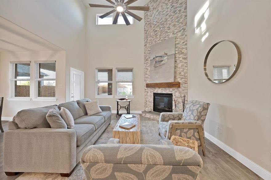 Welcome to this exceptional home in the desirable Silverado community! This Brunswick model is thoughtfully designed 2,208 square feet of open and comfortable living space with four spacious bedrooms and three full bathrooms.
 
Upon entering the home you will appreciate the seamless flow of the open-concept layout, perfect for both everyday living and entertaining guests. The heart of the home features a striking floor-to-ceiling stone fireplace that adds warmth and architectural character to the main living area. Large windows throughout the home allow abundant natural light to enhance the inviting atmosphere, while modern finishes and thoughtful details elevate every space.

The kitchen, living, and dining areas work together effortlessly, creating a welcoming environment for gatherings and daily life. The primary suite is oversized including an expansive walk-in closet.

Step outside into your large backyard, complete with a built-in fire pit that provides an ideal setting for relaxing evenings or memorable outdoor gatherings with friends and family.

The main  community center features a resort-style pool with kids splash pool, clubhouse, basketball and pickle ball courts.  There are two elementary schools, two more additional pools, fire and police department in the community!  Walking paths, dog parks, and playground areas provide opportunities for outdoor enjoyment! 

Located in a fast-growing area with easy access to nearby shopping, dining and outdoor recreation, this home offers the perfect blend of style, space and functionality in one of Aubrey’s most sought-after communities. Do not miss your chance to make this exceptional property your new home!