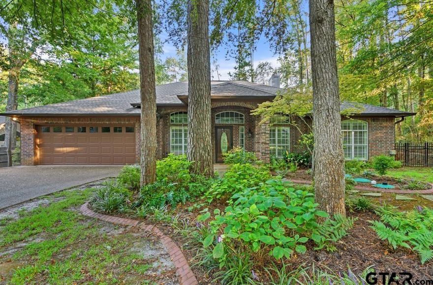 Stop! ... and check out this gorgeous turn key and move-in ready home in Hideaway, Texas! You're welcomed to this fantastic home with excellent curb appeal the moment you turn onto Brookhollow Drive, but that is just the beginning. Soaring ceilings and light and bright neutral colors throughout. High-end Hardwood floors and plantation shutters. Formal dining and a flex room just off of the entry way. The open floor plan is revealed as you enter the living area with wood burning fireplace surrounded by built-ins. The fireplace is a high end Extraordinaire model that is capable of heating the entire home. The open living space flows naturally between the living area, kitchen, breakfast area and huge sunroom that is perfect for entertaining. The well appointed kitchen is complete with double ovens, a gas cooktop (propane), refrigerator, microwave (brand new) and dish washer (brand new). Granite counters, pantry. Large master suite is just off the kitchen and sunroom. Easily large enough for a king size bed and night stands and large bedroom furniture. The master bath hosts the large walk-in closet, separate jetted tub and shower, dual vanities, and separate water closet with storage. Three guest rooms with two additional full baths are positioned on the opposite side of the home. Generac generator. Two car garage. Beyond the sunroom is a beautifully landscaped backyard with iron fencing and a brick work shop that is heated & cooled. The backyard is so peaceful situated back in the large trees, near the back gate of Hideaway. Easy access to Lindale via FM 16. The highly sought after Hideaway Lake and Golf community holds 27 holes of golf and 2 full recreation lakes for boating and fishing, parks including sports courts for pickleball, tennis and basketball, community pools, pro shop and bar and grill amongst it's many amenities. Hideaway also feeds into the award winning Lindale School District in east Texas. NOTE: Four listing photos have been virtually staged