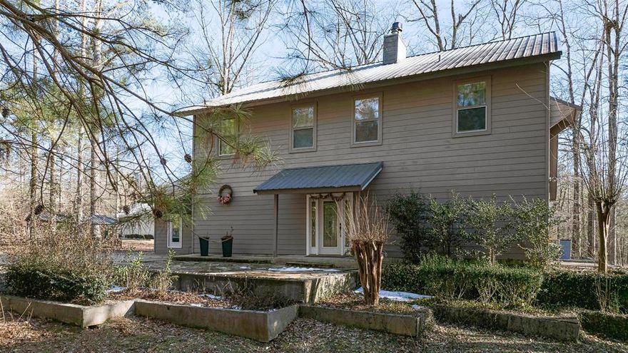 Talk about checking the boxes! You need to come check out 2105 Franklin Ave located in Ruston! Beautiful Custom designed 3 bed 3 bath home Located on a beautiful wooded 2.55 acres with a large metal shop!  This home is set back off of the road about the middle of the property making it nice and private. 

Pull up the driveway and step on inside. 

This is no ordinary home!… Every part of it was thought out to make living the most comfortable here. 

Inside is a nice open floor plan with a large living room area and a nice double sided fireplace!  

You can gather around on those cold winter nights in the living room side or if you’re in the kitchen cooking you can enjoy the fire on that side.   Speaking of the kitchen, if you love to cook, this is gonna be your place!  With a wide open space, and huge windows overlooking the beautiful backyard!it’s like being in a magazine! There’s also a large island bar right in middle!  Directly off of the kitchen and nicely flowing with the house is a large second living room that is one of the coziest rooms in the house! And also has a bedroom and full bathroom right off of it, which would be perfect for a mother-in-law suite. 

Head on upstairs and welcome to the master suite! The entire second story is the master suite with tall ceilings, a separate large jetted Jacuzzi tub, and your own fireplace in your master bedroom! Step out from your bedroom onto your own covered  balcony overlooking your backyard! 

Step out back onto the covered patio and as they say, let the world go by… This place is meant for entertaining! With a large patio sitting area, and a large open, cooking area and a 

pit-masters dream outdoor kitchen! 

With a pizza oven, followed by a real wood, burning smoker,  a regular grill, then a griddle then move over to a gas grill that has a fish cooker inside of it as well! Speaking of entertaining step over to the large fire pit with swings and chairs around it.