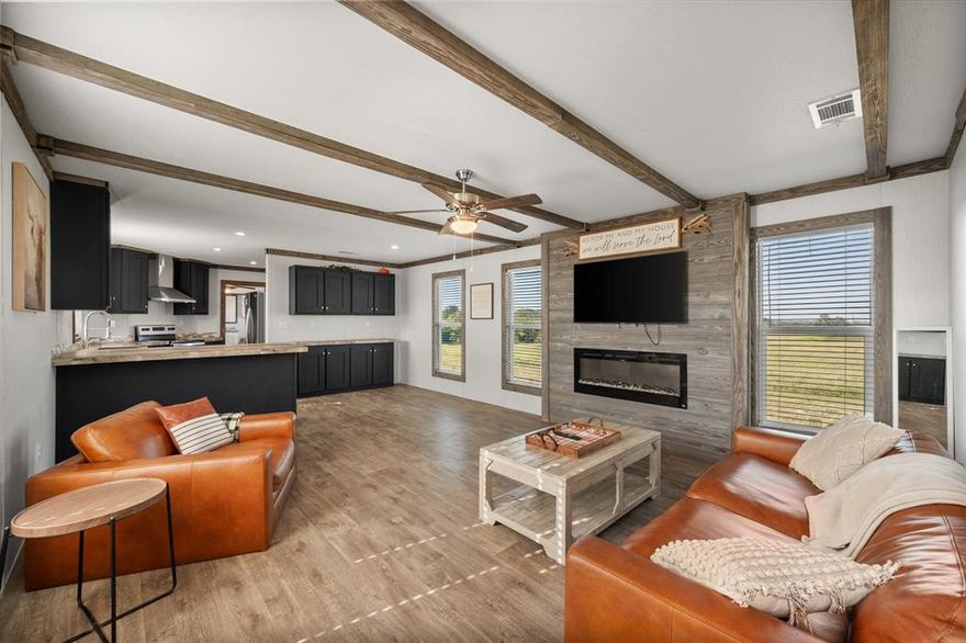 Modern Farmhouse on 8 Acres with Private Pond — Your Peaceful Country Retreat Awaits!

Welcome home to 211 FM 2547 in Fairfield, where modern comfort meets Texas country charm. This beautifully upgraded Mclaughlin Titanium Baytown model features an open-concept layout with rustic wood beams, shiplap accents, and a cozy electric fireplace that creates the perfect gathering space. The kitchen shines with stainless steel appliances, a farmhouse sink, spring-loaded faucet, and rich cabinetry that complements the rustic trim and barnwood doors throughout.

Enjoy the best of country living with eight acres of open land and a private pond—ideal for animals, a shop, or simply soaking in the peace and quiet. With central heat and air, overhead ducts, smart-panel siding, and black metal skirting, this home offers quality, efficiency, and style in one package. Located just minutes from Fairfield and I-45, it’s the perfect blend of tranquility and convenience.

Seller is motivated—schedule your showing today and discover the modern farmhouse lifestyle you’ve been dreaming of.