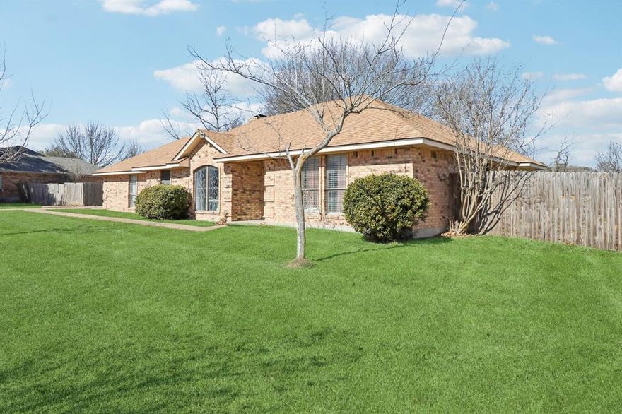 Well cared for, clean, and cozy home located just outside the city limits of Waxahachie. This home is located on just over a half acre with no HOA. Enjoy all Waxahachie has to offer without the City taxes! Conveniently located to schools, I-35E, and shopping. Inside this home you will find 3 full bedrooms, 2 full baths, 1510 square feet, and built in 1984. Newer roof that is only 5 years old so save on home insurance! Walk inside this home and find a very inviting foyer that opens up to the large living room. Living room features a wonderful painted brick wood burning fireplace, high ceilings, and beautiful wood flooring. Just off the living room is the formal dining area perfect for those family dinners. Now step into the large and very functional kitchen that features numerous beautifully painted white cabinetry throughout. Beautiful granite countertops throughout the kitchen, tile flooring, and full electric appliances. Refrigerator, range, built in microwave, and dishwasher. Just off the kitchen is the separate and full size utility room. Built in cabinets in the utility, tile flooring, and with full size washer and dryer. From the utility room you have easy access to the oversized side entry 2 car garage with opener. Bedrooms 2 and 3 both feature ceiling fans and walk in closets. Bathroom 2 is full size with a great shower tub combo. Outside this home has a lot to offer the new owner! Large front yard with full sod and landscaping. Extended driveway, sidewalk, and covered front porch. Backyard features an oversized covered back patio perfect for sitting and relaxing. Separate sitting area located near the numerous large and mature trees. This home has so much to offer it's new owner!