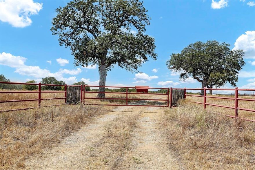 Discover your own piece of paradise on this 26.03-acre ranch with road frontage on two sides, pristine fencing, and a striking red pipe metal gate entrance. Explore the well-maintained ATV trails that wind through the property and encounter a variety of wildlife, including deer and hogs. A tranquil pond adds to the charm, creating a serene spot for relaxation and reflection. With electricity nearby, it's easy to add modern conveniences, making this property perfect for building your weekend getaway or dream home. Secluded and peaceful, this ranch offers an ideal escape into the heart of Texas countryside living. Wether you’re a hunter, an outdoor adventurer, or simply looking for a serene escape from the hustle and bustle of city life, this property offers the ultimate canvas for your vision of rural bliss.