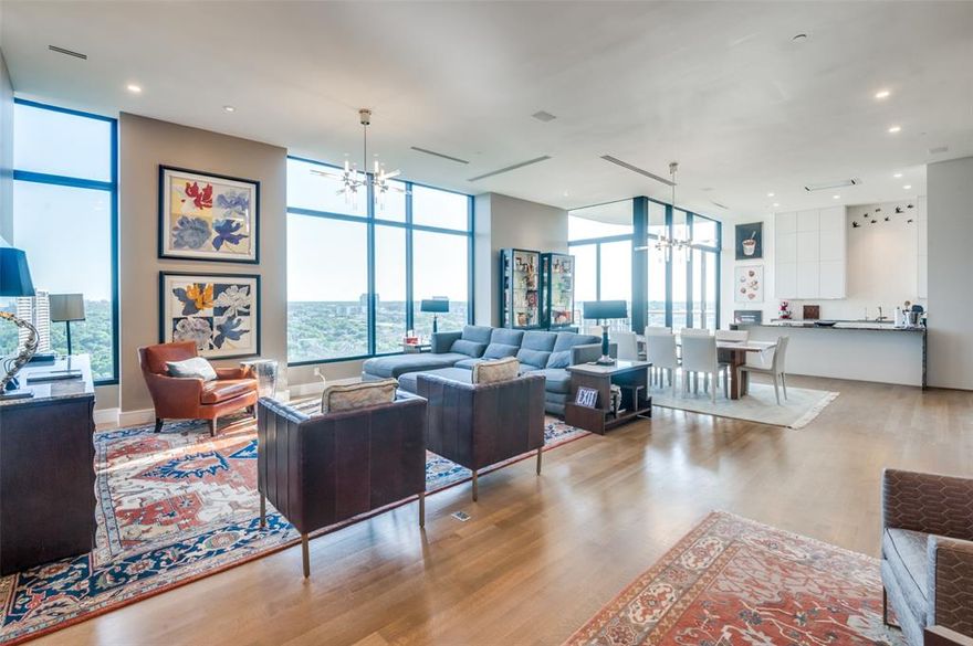 One of a kind totally renovated & reimagined Claridge Penthouse. Double door Entry leads to an impressive open Living, Dining, Kitchen & Bar made especially for entertaining. The finest features include solid white oak rift & quarter sawn floors, 11.5 ft ceilings, marble Baths, Toto toilets, designer chandeliers, 2 full-size wine refrigerators in the Bar & unobstructed views of Turtle Creek Park land, Kalita Humphreys Theater & Katy Trail. The fabulous Chef's Kitchen is outfitted with German cabinets to the ceiling, natural durable quartzite waterfall counters, Gaggenau appliances including extra-large refrigerator-freezer, double ovens, induction cooktop with gas available, and marble backsplash adorned with New Ravana Birds. The Laundry room has a 2nd dishwasher & sink. The spa-like marble Master Bath boasts an extra-long & deep double vanity, Italian lighting, Dornbracht fixtures, walk-in shower, free-standing tub & a 23 ft long closet. Extra large storage & first level parking.