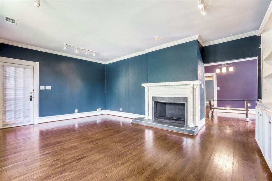 This inviting upper-level duplex blends classic charm with modern comfort. Set along a tree-lined street, the home offers the warmth and character of rich hardwood floors throughout, complemented by abundant natural light streaming in from large windows.
With three spacious bedrooms and two full bathrooms, this home provides ample space for comfortable living. The heart of the home is a cozy living room anchored by a beautiful fireplace — perfect for cool evenings and relaxed gatherings. The adjacent kitchen features a gas range, ideal for cooking enthusiasts, along with plenty of cabinetry and space for casual dining.  Upstairs living offers privacy and a quiet retreat above the bustle of street-level life. This home combines timeless architectural details with practical updates, all in a serene, leafy setting that’s just minutes from shops, parks, and public transit.