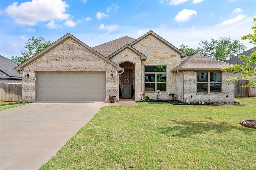 Discover this pristine, like-new 2022 construction home that perfectly blends modern elegance with everyday functionality. Boasting 4 spacious bedrooms, 2 full bathrooms, and a convenient half bath, this residence offers ample space for family living and effortless entertaining. Step inside to an inviting open-concept layout where the living, dining, and kitchen areas flow seamlessly together. The gourmet kitchen is a true standout, featuring custom cabinets, gleaming granite countertops, a large kitchen island, and high-end stainless steel appliances. Designer lighting adds the perfect finishing touch, creating a bright and sophisticated atmosphere throughout. Additional highlights include a dedicated study-office, ideal for remote work or quiet relaxation, and a two-car garage for convenient parking and storage. Outside, enjoy the beautifully covered patio overlooking a professionally landscaped, private backyard — the perfect setting for morning coffee, evening gatherings, or simply unwinding in your own serene oasis. Immaculate, thoughtfully designed, and built with quality finishes, this home is truly turn-key and ready for its next chapter. Come see, come buy!