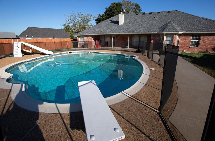Get ready for summer with this gorgeous 5-bedroom, 3.5 bath country home featuring an outdoor oasis—all within commuting distance to Dallas! Relax by the in-ground gunite pool and slide for summer fun or enjoy the cabana's wood-burning fireplace on fall evenings. Home sits on a landscaped acre lot with a backyard batting cage for the kids and a chicken coop. Living room features wood floors, vaulted ceilings and corner fireplace; kitchen offers granite counter tops, breakfast bar, island, double appliances; walk-in pantry; full size sep. utility room w-sink; primary suite boasts vaulted ceilings, french doors leading to backyard, recently remodeled primary bathroom has sep. shower &  tub, sep. vanities & huge walk-in closet; a secondary bathroom was remodeled within the past year as well; flex room off kitchen makes the perfect home gym, game room or office; upstairs bedroom is perfect teen retreat or could easily be used as media room; outdoor building w-covered parking and tons of storage; newer backyard wooden fence. This amazing home has it all at an exceptional value!
