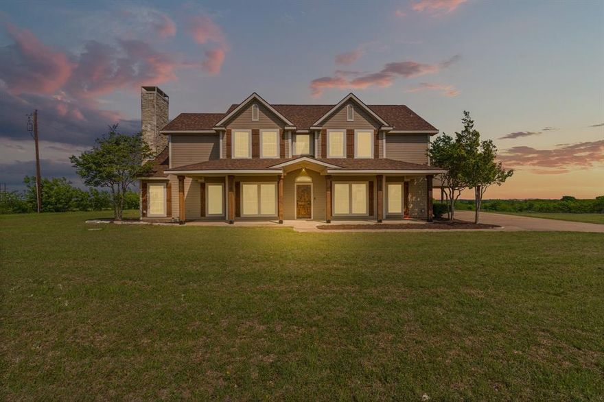 Beautifully crafted 12.51 acre estate offering timeless charm, thoughtful upgrades, and incredible flexibility.  
The heart of the property is a 3,522 sq ft custom home with engineered hardwoods featuring 4 beds, 4 full baths -each bedroom has its own- formal dining, dedicated office space, kitchen, large utility room, full size bay sink, upper-lower cabinets & ample counter space and an expansive two-story living area anchored by a dramatic Austin stone fireplace, perfect for entertaining or cozy evenings.  Designed for the chef, a commercial-grade kitchen, Imperial 6 gas burner range, 24' griddle and two 35' ovens, a massive commissary, ideal for hosting unforgettable gatherings. The 1st floor primary offers a private fireplace, built in cabinetry perfect for a coffee bar and a newly renovated ensuite bath with a full-size soaking tub, large walk-in shower for spa-like comfort, plus double closets. Not one, but 2 tankless water heaters. Step outside and take in a breathtaking scene...each Spring, the property is blanketed with iconic Texas wildflowers, including bluebonnets & Indian paintbrush that surround the landscape with color and beauty.  Lush Coastal Bermuda pasture, perfect for grazing, recreation, or future expansion. 40 yr high impact fiberglass roof. For the workshop enthusiast, discover your happy place in a 24X60, garage parking, insulated, 12' concrete slab equipped with an air compressor piped with 2 hose reels bolted on its own concrete slab just outside.  Percolating septic, 1500 gallon for room to grow, 500 gallon owned & buried propane tank, RV hookup & Ag Exempt. Unwind on the covered front porch as you take in breathtaking Texas sunsets and watch private planes land at nearby Midway Regional Airport, savor the peaceful sounds of country life under a star-filled sky. Located in the sought-after Midlothian ISD, this one-of-a-kind property blends space, serenity, and lifestyle flexibility & the perfect property for multigenerational living!