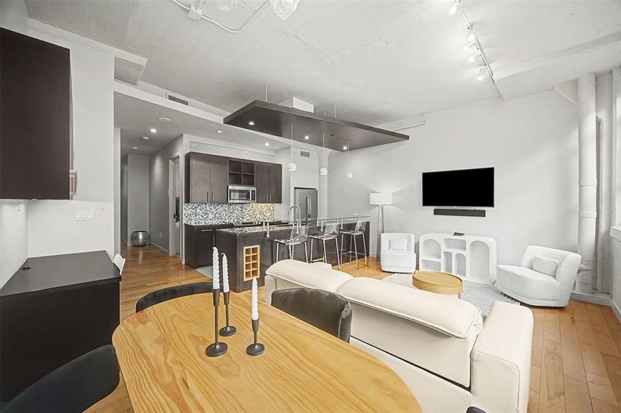 Discover an unparalleled opportunity to reside in the prestigious Historic Montgomery Plaza, Fort Worth's iconic landmark of refined urban luxury. This exquisite West Tower residence features 2 generously appointed bedrooms, 2 full baths, and 2 deeded parking spaces (#2179 & #2180) for ultimate convenience. Enjoy a sophisticated open floor plan with split bedrooms, rich hardwood and tile flooring, premium stainless steel appliances, in-unit washer & dryer, expansive walk-in closets, and abundant storage—blending spaciousness with elegance.

Positioned on the 5th floor of this distinguished 1928 Art Deco conversion, the home offers timeless charm and modern luxury.
Experience a resort-inspired lifestyle with 24-hour concierge service and Texas's largest rooftop pool deck—nearly an acre of unparalleled elegance. Relax in six private cabanas, by the stunning infinity-edge pool with water features and separate spa, around five fire pits, or in two sophisticated outdoor living areas with plush seating, gas grills, and dining spaces.

Exclusive amenities include a refined owners' lounge for events, a premier 14-seat theater, and a newly renovated state-of-the-art fitness center.
Just minutes from vibrant downtown Fort Worth, Sundance Square, and the premier entertainment cultural districts, with easy access via daily public transit and the DASH.

Move-in ready—this is more than a residence; it’s an exclusive lifestyle of timeless elegance and modern opulence in the heart of Fort Worth.