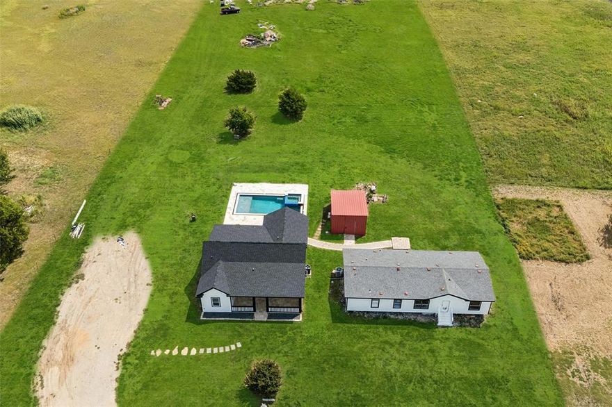 Welcome to this newly built one-story home set on 2.5 acres, complete with a 2nd home, and a brand-new custom swimming pool designed for both relaxation and entertainment. Then main home is offers 3 bedrooms, 2 full bathrooms, and luxury vinyl plank flooring throughout the main areas. The primary bedroom has an ensuite and split from the other bedrooms allowing for privacy! Adding to its appeal, the property includes a second home—a mobile home that offers endless versatility. It could serve as a guest house for visiting family and friends, a convenient pool house, a man cave or creative studio, or even a rental property that generates additional income. This added living space makes the property uniquely flexible, whether you envision multigenerational living or simply want extra room to spread out. The expansive backyard is truly the heart of this property. A sparkling pool invites you to host unforgettable summer gatherings, while the oversized covered patio comes equipped with an outdoor kitchen. After a long day of swimming, gather around the stone fire pit for cozy evenings under the stars. Every detail of this outdoor retreat has been designed to make you feel like every day is a vacation. All of this is set in a great location, just five minutes from the local elementary school and Highway 380, offering the perfect blend of privacy and accessibility.