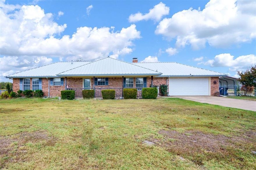 Welcome to this charming, well-maintained ranch-style home built in 1994. Featuring a welcoming front porch and a durable metal roof, this property offers both style and longevity. Step inside to discover a spacious family room adorned with a cozy fireplace, perfect for gatherings. The kitchen boasts a generous eating area, ideal for family meals and entertaining. A large utility room adds convenience to your daily routine. Enjoy outdoor living on the covered back patio, perfect for relaxation or barbecues. The expansive lot provides ample space for outdoor activities and gardening. With easy access to I-30 and Hwy 78, you’ll appreciate the blend of small-town charm and modern convenience. Don't miss the opportunity to make this delightful home your own!