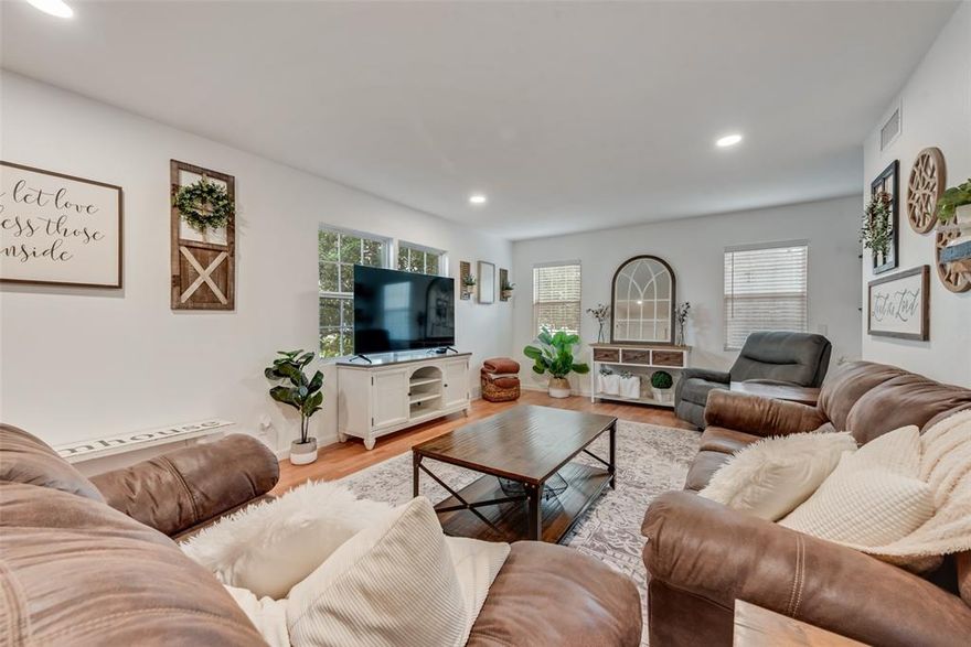 This charming three-bedroom, two-bathroom home welcomes you with its bright and fresh open floor plan that flows seamlessly throughout. Modern updates blend perfectly with cozy touches, including a warm fireplace that creates the perfect gathering spot. The welcoming interior opens to a lovely backyard featuring pretty mature trees that provide natural beauty and shade. Located with convenient highway access, this updated gem offers the ideal combination of comfort and connectivity. The thoughtful layout maximizes space while maintaining an inviting atmosphere perfect for both daily living and entertaining guests.