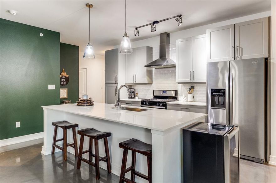 Modern Luxury Meets Urban Lifestyle. Welcome to 5710 McCommas #103, where contemporary design meets the ease of lock-and-leave living. Nestled just moments from Greenville Avenue, SMU, and Mockingbird Station, this corner unit and former model condo places you in the heart of Dallas’ most vibrant neighborhood—steps from morning coffee, weekend brunch, and lively evenings out. Inside, the open-concept layout is designed for both comfort and style. A chef-inspired kitchen with stainless appliances, sleek cabinetry, and generous prep space—perfect for everything from a quick breakfast to hosting friends. A light-filled living area with clean lines and modern finishes that create an inviting atmosphere. A tranquil primary suite paired with an updated spa-like bath, offering boutique-hotel comfort at home. A private patio ideal for morning coffee or unwinding with a glass of wine after the day. Gated parking with 2 reserved spots, in-unit laundry room, polished concrete floors and a meticulously maintained community which includes a dog area and roof top entertainment area ensure convenience and peace of mind. For the professional who values both sophistication and connection, this condo delivers a lifestyle where home is not only a retreat, but also your gateway to the best of Dallas.