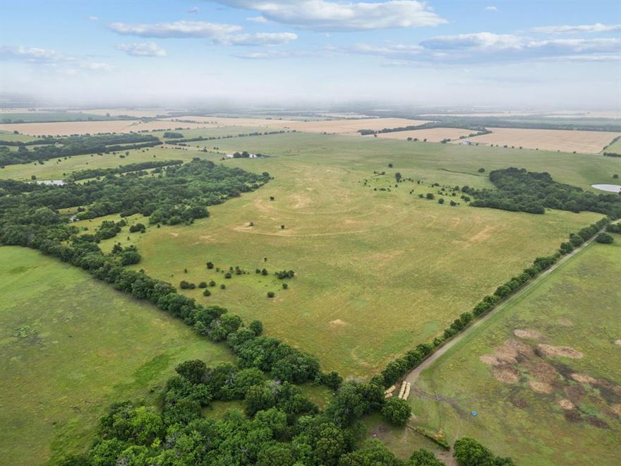 Rare opportunity to own this 244+ acres in Grayson County! Welcome to your slice of Texas paradise—244+ sprawling acres offering the perfect blend of open pasture, mature hardwoods, and wide-open skies. Whether you’re looking to build your dream ranch, expand your agricultural operation, or invest in prime land with serious future potential, this property checks all the boxes. Located just 65 miles from Dallas, 30 miles to McKinney, and only 20 miles to Sherman, this property combines the serenity of the countryside with convenient access to major city amenities.
Highlights include: Three stocked ponds, ideal for livestock or peaceful fishing afternoons. Large barn, ready for equipment, hay storage, or livestock shelter. Water and electricity already onsite—making building a homesite or agricultural use a breeze. Gently rolling pastures, perfect for grazing or hay production. Secluded wooded areas offering privacy, wildlife habitat, or trail opportunities.
Property offers access and frontage from three roads (FM-697, One Mile Lane, and Whitworth).
Currently used for farming and ranching with an ag exemption in place, this versatile acreage offers countless possibilities—whether you’re envisioning a working ranch, a weekend retreat, or a long-term investment with high growth potential.
Don’t miss this rare chance to own a large, utility-ready tract of land in one of North Texas’s most desirable and rapidly growing regions!
MUST have an appointment to see this property. Listing agent will be present for all showings. Current cattle lease in place, with cattle on site.