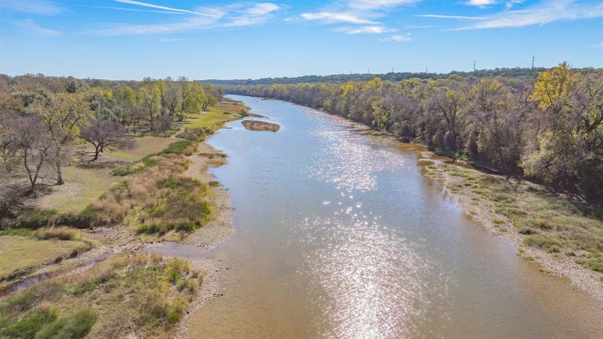 Discover Riverfront Living at Its Finest on 6521 Edgewood Ct. in Pecan Plantation. Nestled at the end of a quiet cul-de-sac, this stunning two-story home offers over 2,600 sq ft of comfortable, scenic living—set directly on the river with breathtaking views from nearly every room. Wake up each morning to the tranquil sound of flowing water and the soft calls of birds along the riverbank, and watch wild turkey and deer wander by from your patio or upstairs balcony.  Step inside to a warm, inviting and very spacious layout featuring a spacious open-concept living and dining area with a cozy fireplace, built-in bookshelves, and exceptional storage throughout. Large windows frame the natural beauty outside, creating a peaceful atmosphere that flows through the entire home.  The updated kitchen is designed for both cooking and gathering, complete with granite countertops, stainless steel appliances, and a GE Profile double-oven range—perfect for hosting holidays, meal prep, or casual evenings with friends.  Upstairs, more river views await, giving every bedroom a serene backdrop and making each space feel like a private retreat with each having their own door to the balcony.  The large primary suite has a nice updated shower and double vanities.  Located on the golf cart path with easy access straight to the clubhouse, this home offers convenience paired with resort-style amenities inside the highly sought-after, gated community of Pecan Plantation. Residents enjoy a Golf Course, 2 swimming pools, clubhouse, recreational center, basketball court, soccer fields & walking paths, community garden, On-site shopping center which includes a grocery store, Ace Hardware, medical clinic, bank, vet clinic, coffee shop, eateries, and more. Whether you're drawn to the wildlife, the water, the amenities, or the peaceful lifestyle, this riverfront home delivers a rare blend of comfort, nature, and community.  Come experience the beauty of life on the river ready to Welcome you Home!