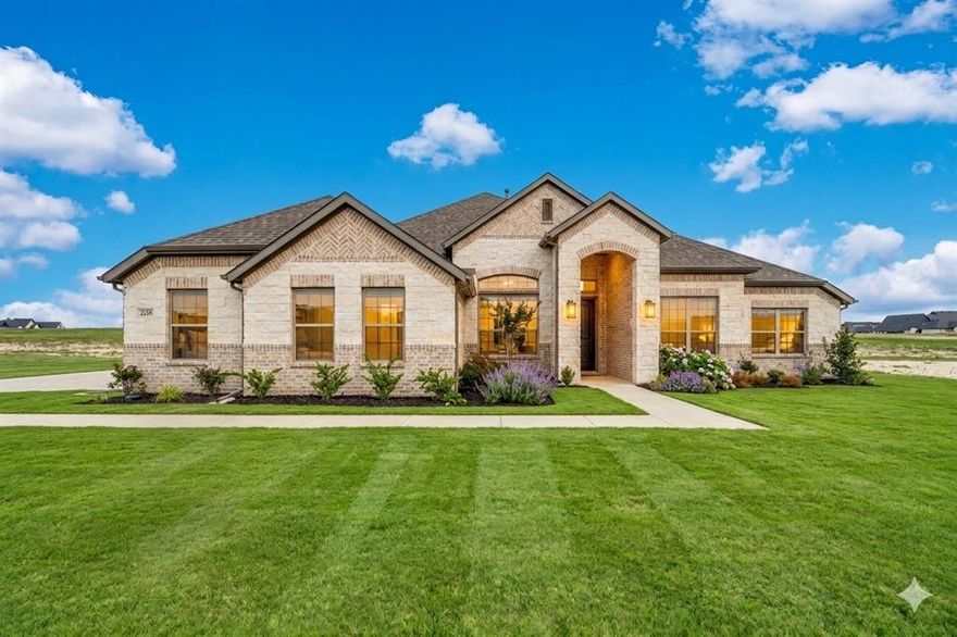 Beautiful new construction by Altura Homes located in the desirable Levante community near Lake Waxahachie. Situated on a spacious 1-acre homesite, this thoughtfully designed single-story Dartmouth VI floorplan offers 2,355 square feet with 4 bedrooms, 2 bathrooms, a study, and a 3-car garage.
The open-concept layout features soaring vaulted ceilings, abundant natural light, and wood flooring throughout the main living areas. The spacious living room centers around a cozy gas log fireplace and flows seamlessly into the chef’s kitchen, complete with granite countertops, a large island with seating, gas cooktop, stainless appliances, and a walk-in pantry—perfect for entertaining or everyday living.
The private owner’s suite offers a peaceful retreat with vaulted ceilings, dual vanities, a garden tub, separate glass shower, and a large walk-in closet. Three additional bedrooms and a full bath provide flexible space for family or guests, while the dedicated study is ideal for a home office.
Additional highlights include a mudroom with built-ins, oversized utility room with cabinetry and space for an additional freezer, decorative lighting, and smart layout for everyday convenience.
Enjoy outdoor living on the covered patio overlooking the expansive backyard, offering plenty of room for a pool, shop, or outdoor entertaining.
Located just minutes from Lake Waxahachie, boat ramp access, and convenient routes to I-35E, this home combines peaceful country living with easy access to shopping, dining, and Waxahachie ISD schools.