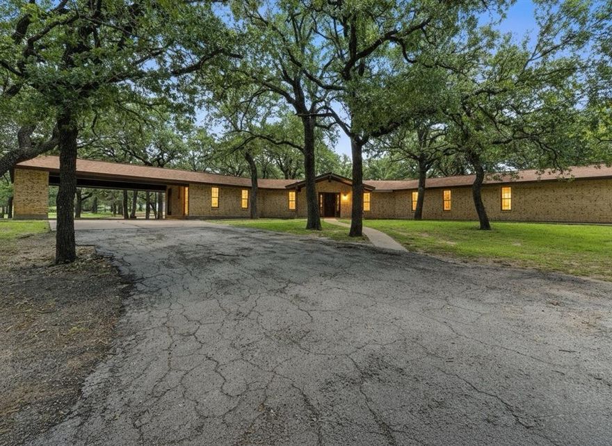 Welcome to Your New Country Retreat- a Sprawling 10+ Acre Ranchette. Turn into the Piped Fenced Gated Entrance and Follow the Paved Driveway Up to this Well Built Ranch Style Brick Home that is Nestled on Over 10+ Acres with Large Mature Oak Trees and Features 3 Bedrooms with 3 Full Bathrooms. The Living Room has a Vaulted Ceiling with Wooden Beams, Rock Fireplace with Builtins on Both Sides. The Kitchen has an Island for Extra Prep Space as Well, as an Inviting Place for Guest to Hang Out. The Back Porch is Covered for a Great Spot to Sit Out and Enjoy the Country Lifestyle. This Property Continues to Appeal to a Lover of All Things Outside the Home with Large Metal Shop with Concrete Floor and Electricity; that is Ideal for Projects, a ManCave, a Workshop or a Storage. Additional Metal Building, with Stall and Pipe Fenced Turnout with Attached Tack or Feed Room Complete with Electricity; Loafing Shed with Attached Overhang for More Equipment Storage or Hay Storage. RV or Living Quarters Trailer Hookup. This Completely Fenced & Cross Fenced Property is a Rare Find; Surrounded by Large, Mature Oaks Trees, Coastal Pasture and Sandy Soil. This Property is Prefect for an Arena, the Ground is GREAT! Don’t Miss this Property with Unbeatable Potential! If You have been Dreaming of a Property with Good Solid Bones, Functional Infrastructure, Tons of Potential, as well as the Opportunity to Make it Your Own by Adding Your Own Custom Updates for a Unique Custom Feel then You Need to See this Property! Come Enjoy Country Living with Room to Roam and Peaceful Surroundings in Cowboy Capital of the World. Located Very Close to 377 Arena, Minutes from Downtown Stephenville and Tarleton State University. Easy Ability to Commute if Needed.