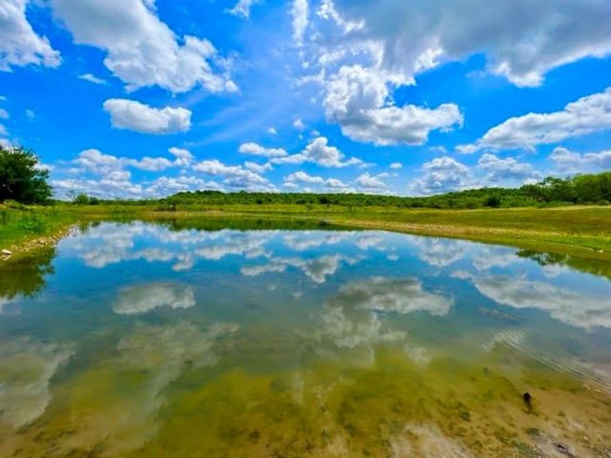 Lost Valley Ranch is a 475-acre gem in beautiful Callahan County.  Located 10 minutes to Lake Coleman, 30 minutes to Abilene and 2 hours from Fort Worth.
Lost Valley Ranch has a tree-covered mountain ridge that runs north into the ranch and then splits into a 150+-acre valley. Years of brush management have left the lower meadows covered in strong native grasses.
The main valley has a large pond which has been known to produce some impressive bass, as well as attracting a multitude of game birds.  The wildlife population includes whitetail deer, turkey, dove, wild hogs. 
Power is on-site, and there is one electric water well and one solar well with storage tanks in place. A new Coleman County water meter is expected to be installed by October 1, 2023. The seller will convey all owned mineral and executive rights to buyer at closing.

**Additional contiguous acreage available**