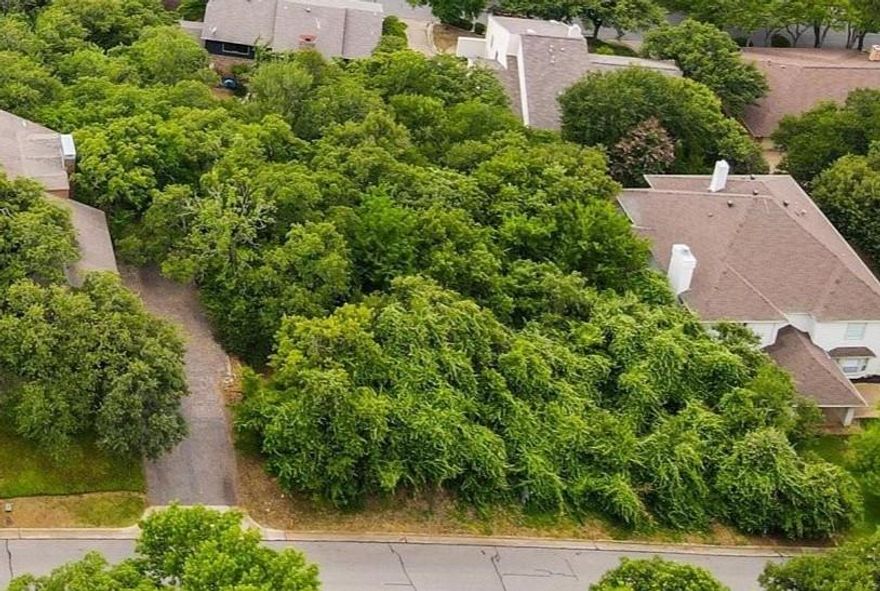 Exclusive Wooded lot in located in sought after Interlochen Estates.  Great location 15 minutes from DFW Airport. This lot is a prime location to build your dream home!