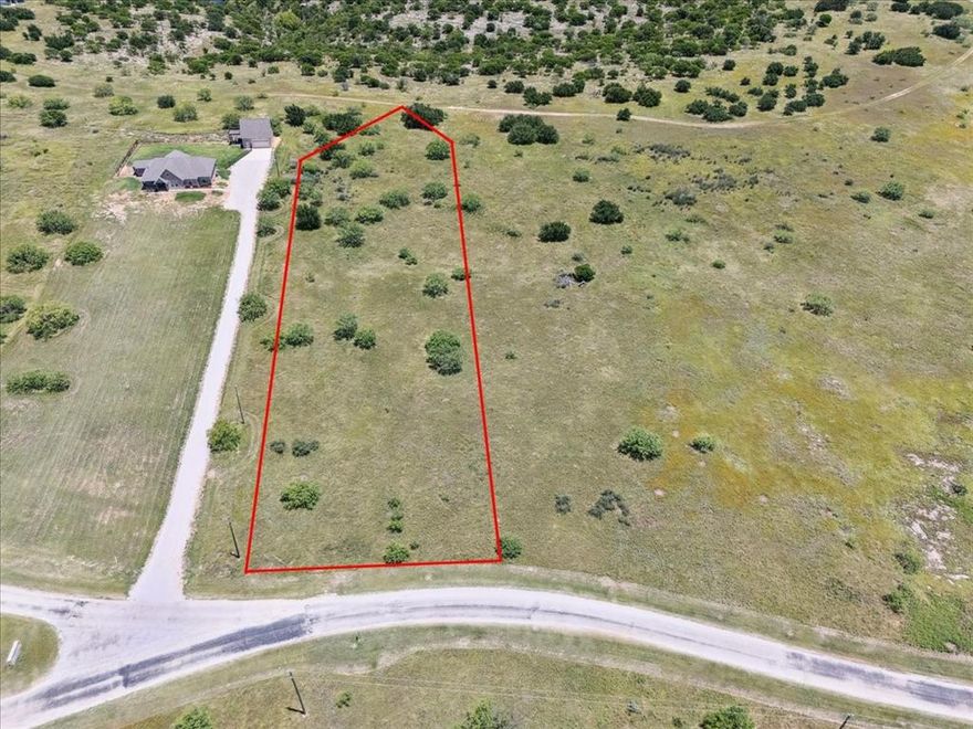 This Prime 4.1 acre lot in the prestigious gated community of Gaines Bend on Possum Kingdom Lake is the perfect opportunity to build your dream home or vacation rental! This property features a level topography, ideal for an easier foundation when building and allowing gorgeous lake views from your second-floor retreat. You’ll love the natural and calming wildlife that roam freely in the area. Enjoy paved road access for added convenience, and utilities including water, sewer, and electricity accessible from the street.Located just minutes from the community boat ramp, courtesy docks, and rental slips, this lot offers excellent access to lake activities. The Retreat at Gaines Bend allows short-term rentals, providing great investment potential. Residents can also enjoy ATV and golf cart access throughout the community.Don't miss this opportunity to build in one of Possum Kingdom Lake's most sought-after communities!